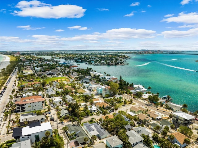 aerial view of property and surrounding area with a nearby body of water and nearby suburban area
