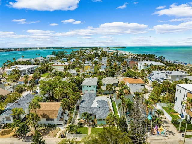 aerial view of residential area featuring a nearby body of water