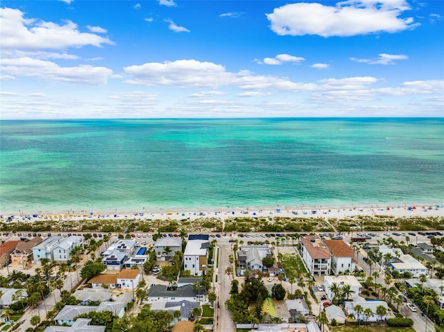 aerial view of residential area featuring waterfront with a beach