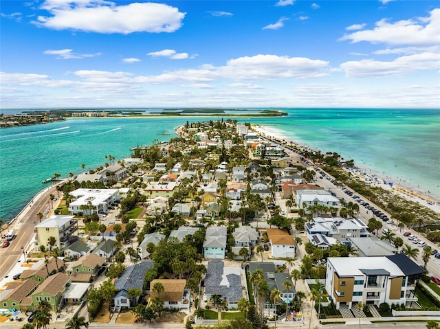 aerial perspective of suburban area with a nearby body of water