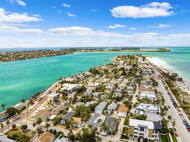 view of property location with a nearby body of water and nearby suburban area