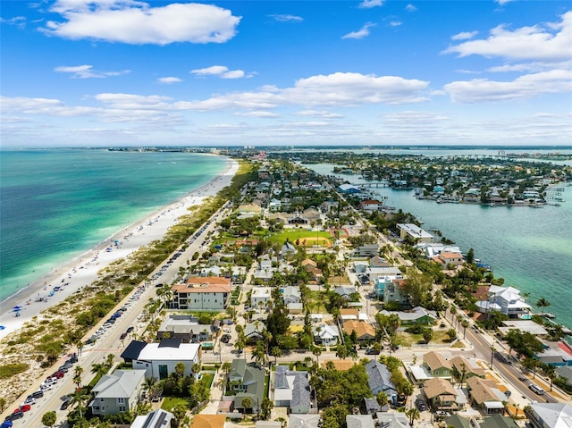 aerial view of residential area with expansive beach