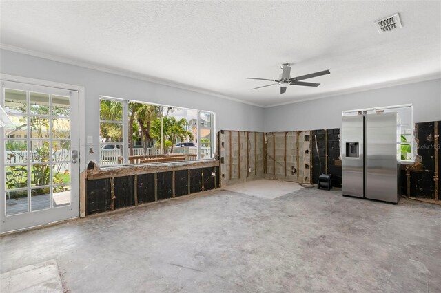106 13th Ave, St Pete Beach, FL 33706 - unfurnished living room featuring ornamental molding, plenty of natural light, and a ceiling fan