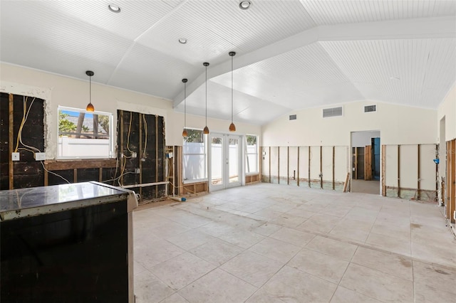 106 13th Ave, St Pete Beach, FL 33706 - kitchen featuring vaulted ceiling, pendant lighting, french doors, and open floor plan