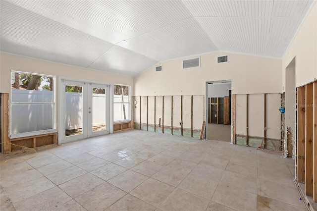 106 13th Ave, St Pete Beach, FL 33706 - spare room featuring french doors and vaulted ceiling