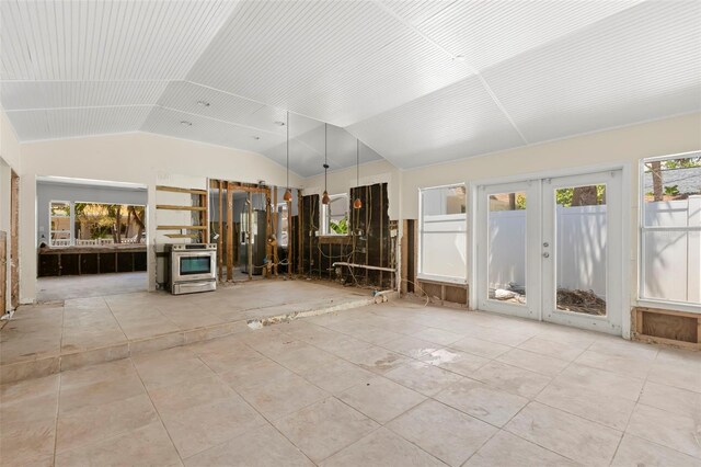 106 13th Ave, St Pete Beach, FL 33706 - unfurnished sunroom featuring french doors and vaulted ceiling