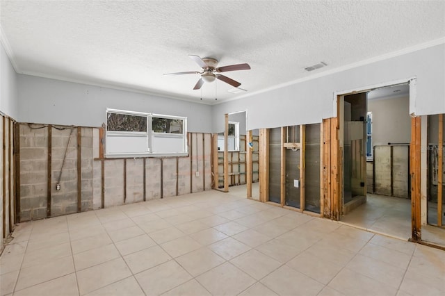 106 13th Ave, St Pete Beach, FL 33706 - tiled spare room featuring ceiling fan, crown molding, and a textured ceiling