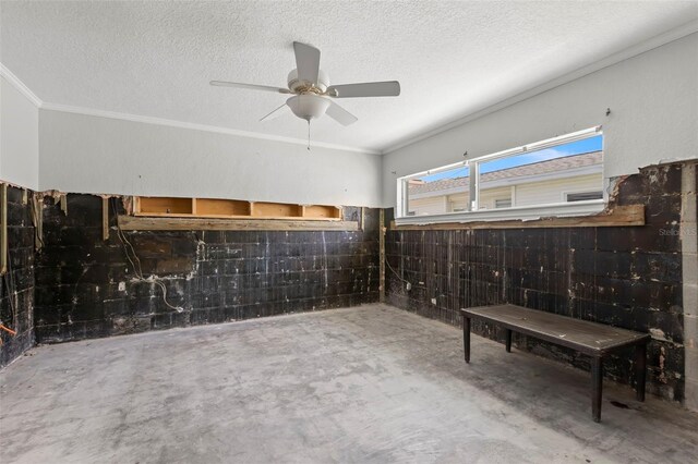 106 13th Ave, St Pete Beach, FL 33706 - misc room with concrete flooring, a ceiling fan, a textured ceiling, and crown molding