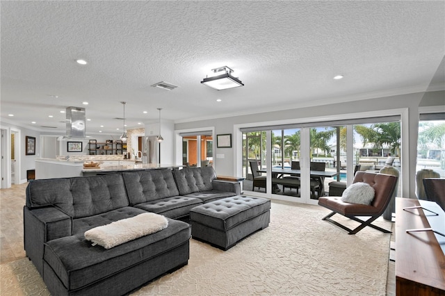 1960 Montana Ave NE, Saint Petersburg, FL 33703 - living area with recessed lighting, ornamental molding, and a textured ceiling