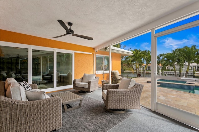 1960 Montana Ave NE, Saint Petersburg, FL 33703 - sunroom with an outdoor hangout area, a hot tub, a ceiling fan, and a water view