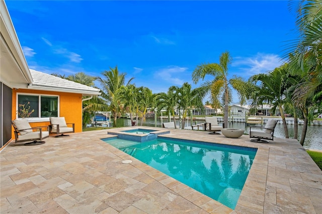 1960 Montana Ave NE, Saint Petersburg, FL 33703 - view of pool featuring a patio, a water view, and a pool with connected hot tub