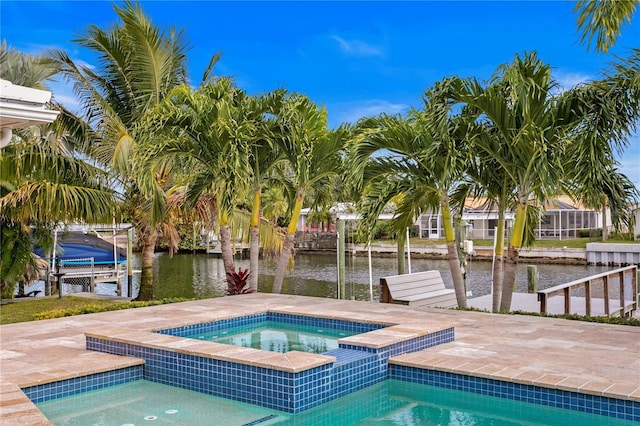1960 Montana Ave NE, Saint Petersburg, FL 33703 - view of pool featuring an in-ground hot tub, a dock, a water view, and boat lift