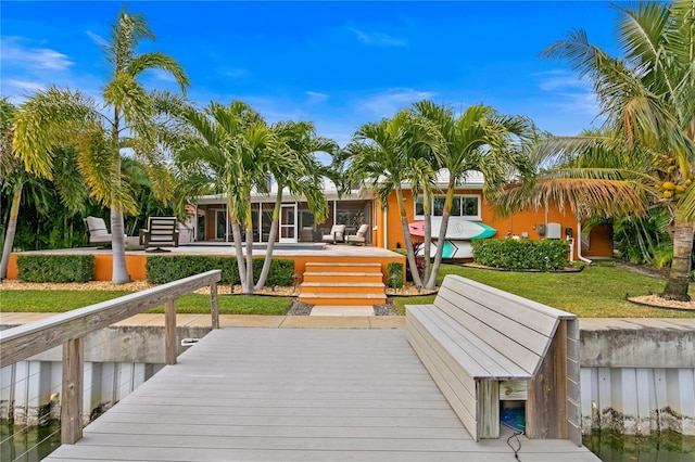 1960 Montana Ave NE, Saint Petersburg, FL 33703 - dock area featuring a wooden deck and a swimming pool