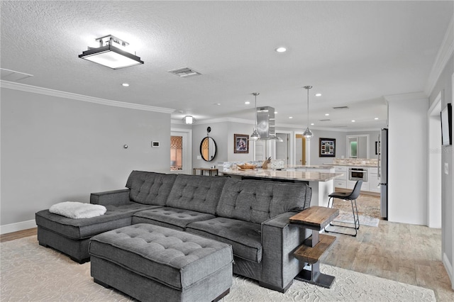 1960 Montana Ave NE, Saint Petersburg, FL 33703 - living area featuring light wood-type flooring, recessed lighting, crown molding, and baseboards
