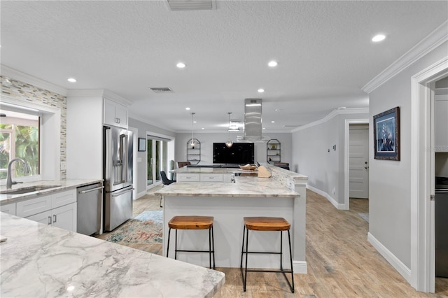 1960 Montana Ave NE, Saint Petersburg, FL 33703 - kitchen with appliances with stainless steel finishes, a sink, ornamental molding, recessed lighting, and white cabinets