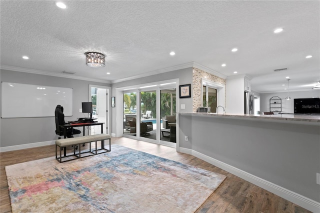 1960 Montana Ave NE, Saint Petersburg, FL 33703 - office with wood finished floors, baseboards, ornamental molding, recessed lighting, and a textured ceiling