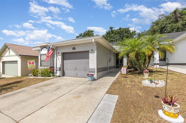 640 Lake Dexter Cir, Winter Haven, FL 33884 - ranch-style home featuring an attached garage, driveway, and stucco siding