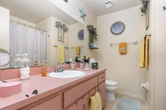640 Lake Dexter Cir, Winter Haven, FL 33884 - full bath with toilet, tile patterned floors, baseboards, double vanity, and a shower with curtain