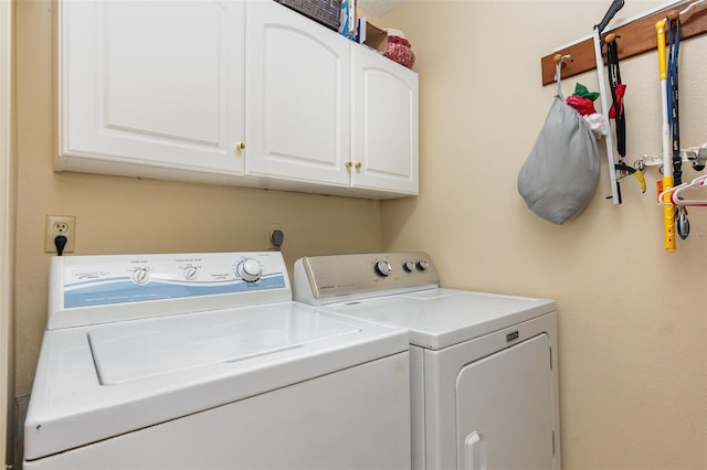 640 Lake Dexter Cir, Winter Haven, FL 33884 - laundry room with cabinet space and independent washer and dryer