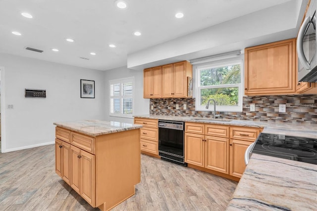 13533 Bay Lake Ln, Tampa, FL 33618 - kitchen with dishwasher, a sink, stainless steel microwave, light wood-style flooring, and recessed lighting