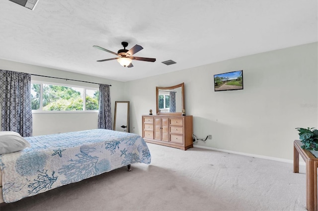 13533 Bay Lake Ln, Tampa, FL 33618 - bedroom with carpet floors, baseboards, and ceiling fan