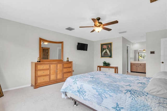 13533 Bay Lake Ln, Tampa, FL 33618 - bedroom with light colored carpet, baseboards, and ceiling fan