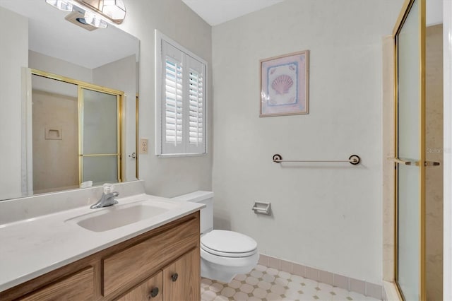 13533 Bay Lake Ln, Tampa, FL 33618 - bathroom with vanity, a stall shower, toilet, and baseboards