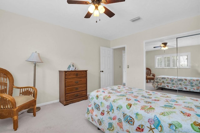 13533 Bay Lake Ln, Tampa, FL 33618 - bedroom featuring light carpet, a closet, and ceiling fan