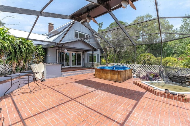 13533 Bay Lake Ln, Tampa, FL 33618 - view of patio / terrace with french doors, a hot tub, and glass enclosure