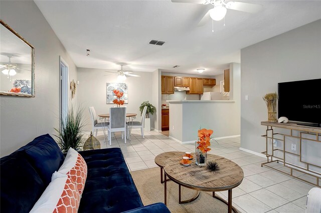 1400 Gandy Blvd N Unit 1504, Saint Petersburg, FL 33702 - living area with ceiling fan, light tile patterned floors, and baseboards