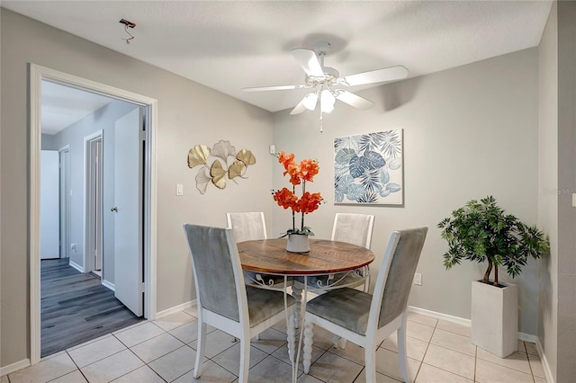1400 Gandy Blvd N Unit 1504, Saint Petersburg, FL 33702 - dining room featuring light tile patterned floors, a ceiling fan, and baseboards