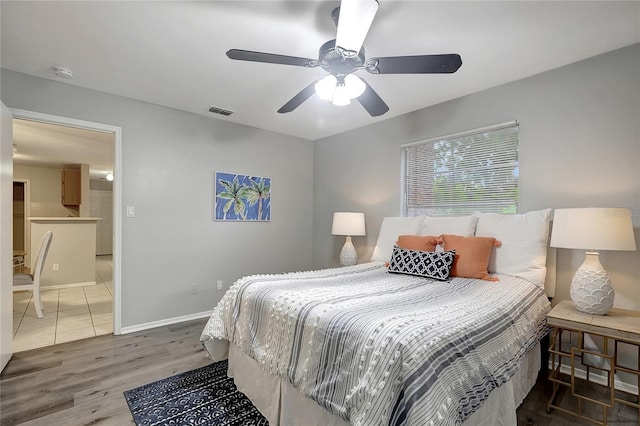 1400 Gandy Blvd N Unit 1504, Saint Petersburg, FL 33702 - bedroom with wood finished floors, a ceiling fan, and baseboards