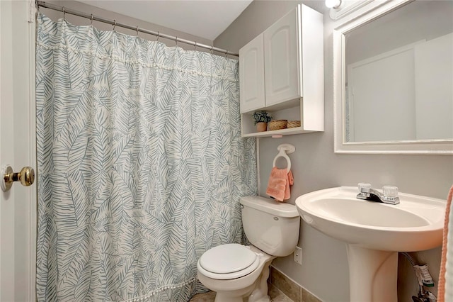 1400 Gandy Blvd N Unit 1504, Saint Petersburg, FL 33702 - bathroom featuring toilet, tile patterned flooring, and a shower with shower curtain