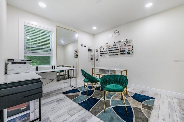 interior space with wood finished floors, baseboards, and recessed lighting