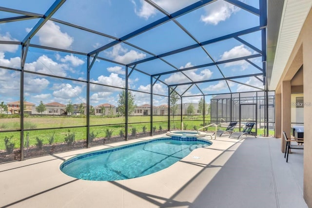 view of pool featuring a patio area, a pool with connected hot tub, a lanai, and a residential view