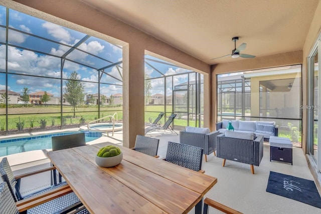 view of patio / terrace featuring outdoor dining space, outdoor lounge area, ceiling fan, glass enclosure, and a pool with connected hot tub