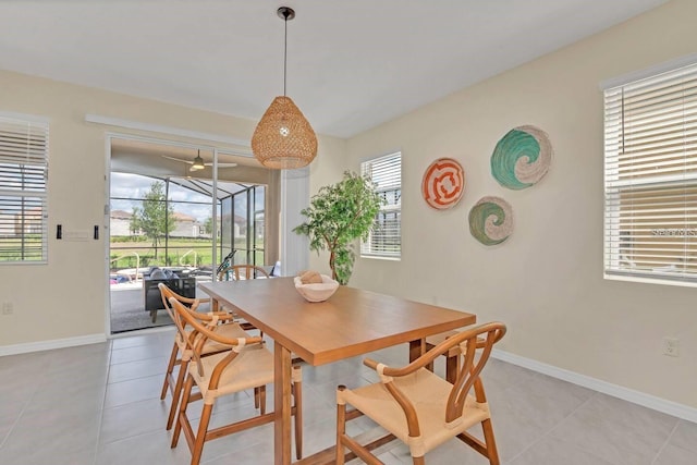 dining area with light tile patterned floors and baseboards