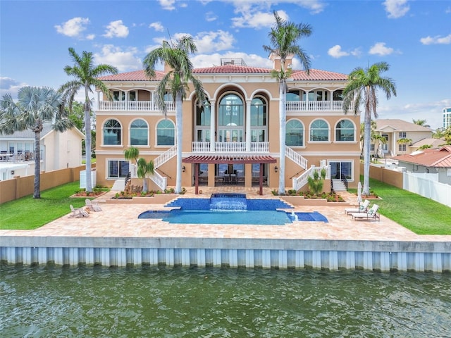 5810 Mariner St, Tampa, FL 33609 - back of house with stairway, a balcony, and a patio area