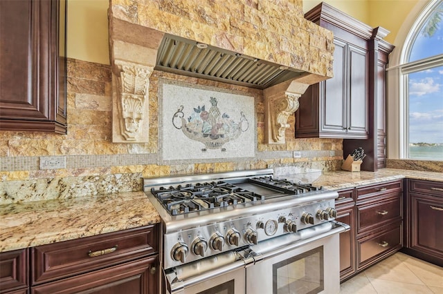 5810 Mariner St, Tampa, FL 33609 - kitchen featuring range with two ovens, healthy amount of natural light, and backsplash