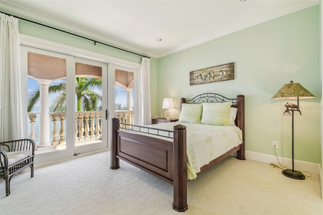 5810 Mariner St, Tampa, FL 33609 - bedroom with access to outside, light carpet, baseboards, and crown molding