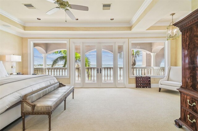 5810 Mariner St, Tampa, FL 33609 - carpeted bedroom with access to exterior, ornamental molding, and a chandelier