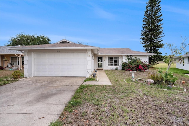 8305 Palencia Dr, Port Richey, FL 34668 - ranch-style home featuring a garage, stucco siding, concrete driveway, and a front lawn