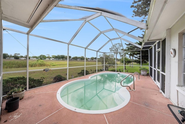 8305 Palencia Dr, Port Richey, FL 34668 - swimming pool with a patio and glass enclosure