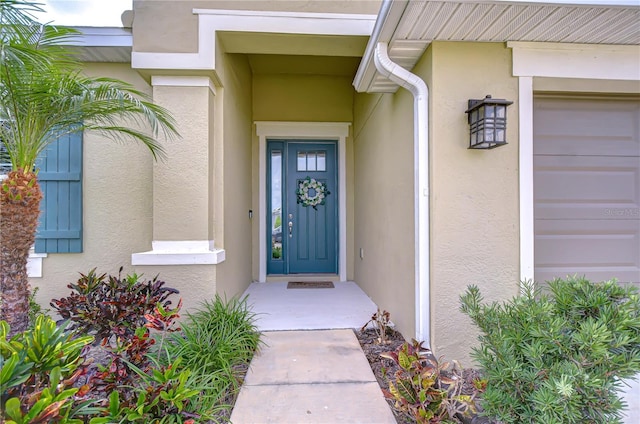 property entrance featuring stucco siding