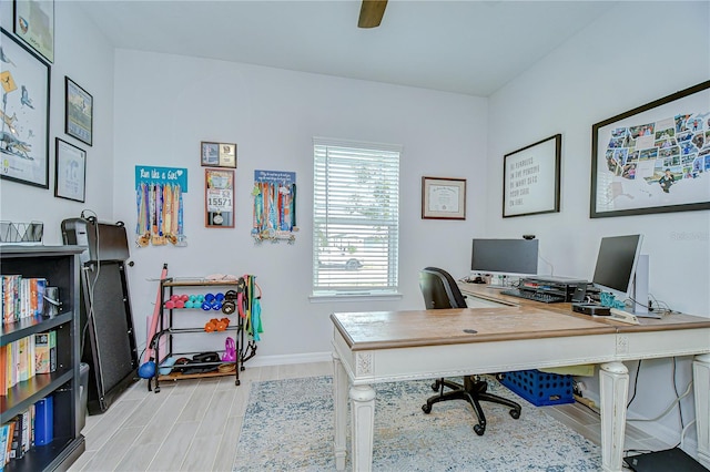 home office with wood finished floors and baseboards