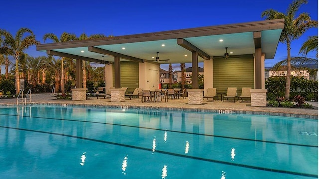 community pool with ceiling fan and a patio