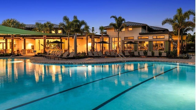 community pool with a patio area