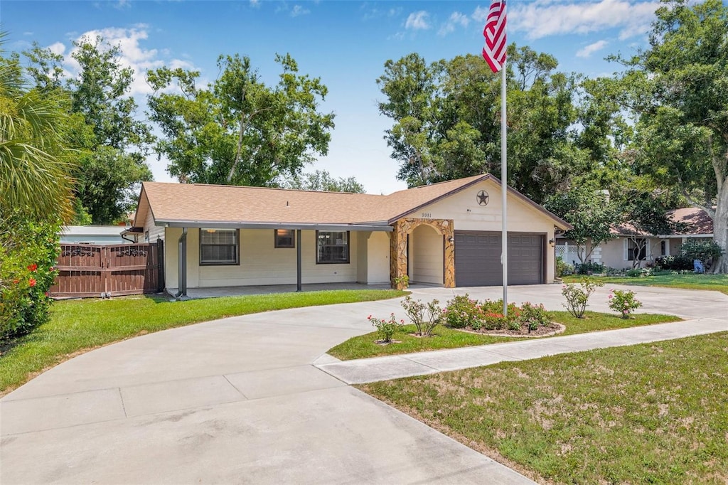 9981 58th St N, Pinellas Park, FL 33782 - ranch-style house featuring driveway and a garage
