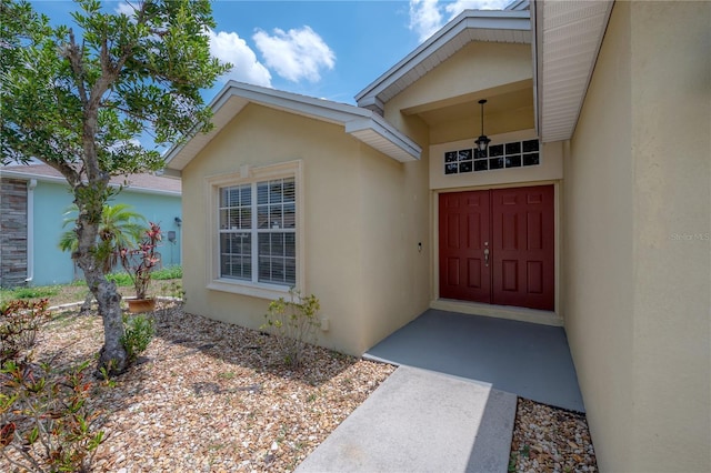 14614 Rannoch Moor Pl, Wimauma, FL 33598 - view of exterior entry featuring stucco siding