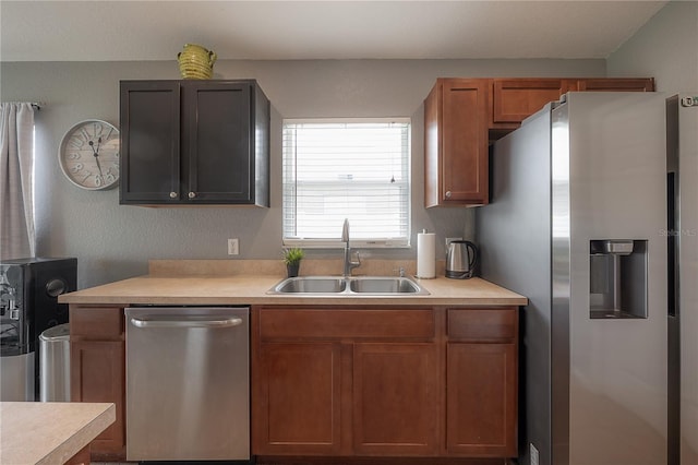 14614 Rannoch Moor Pl, Wimauma, FL 33598 - kitchen featuring appliances with stainless steel finishes, light countertops, and brown cabinetry